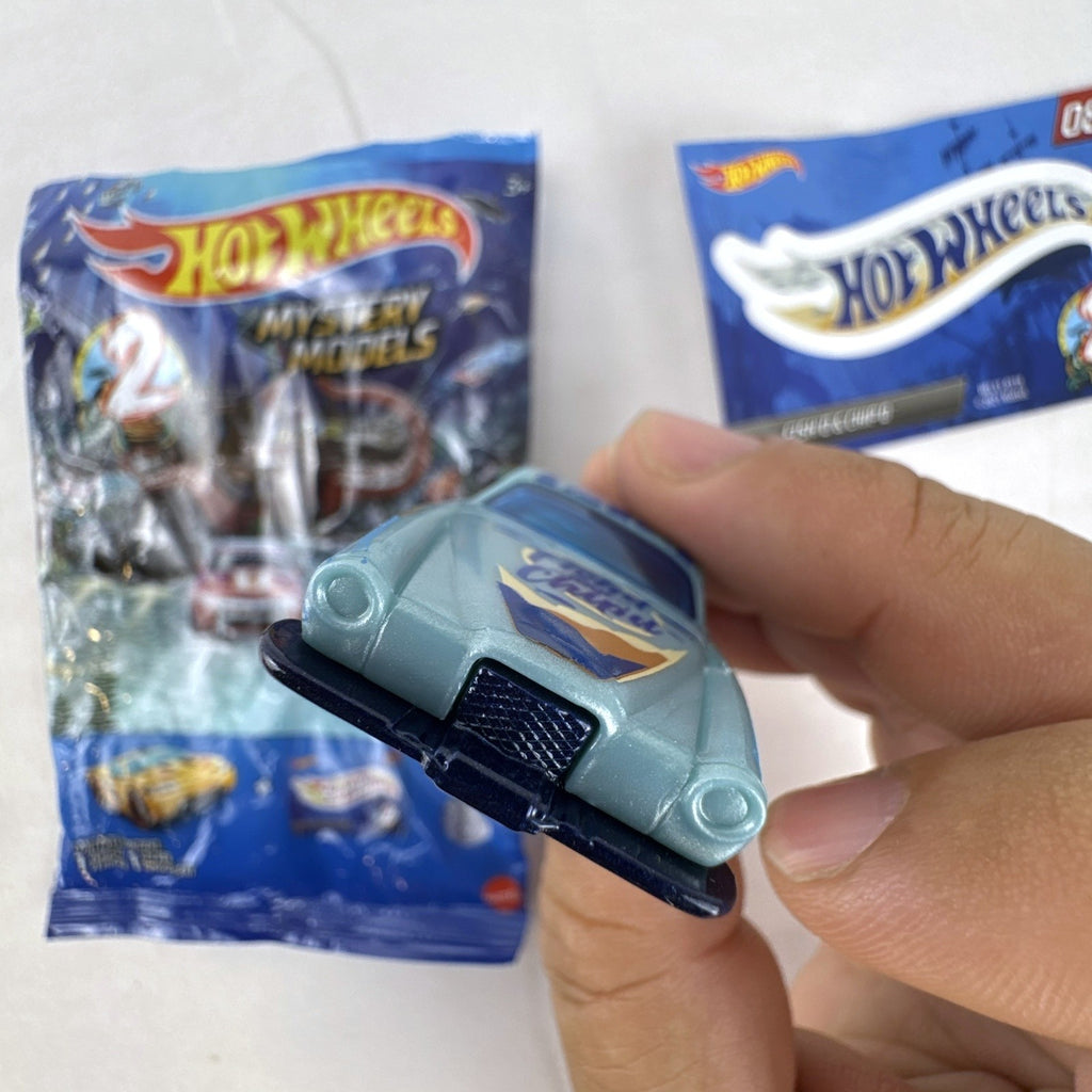 Hot Wheels Fish'd & Chip'd 1:64 scale diecast car in light blue with Union Jack roof graphic and bonus sticker.