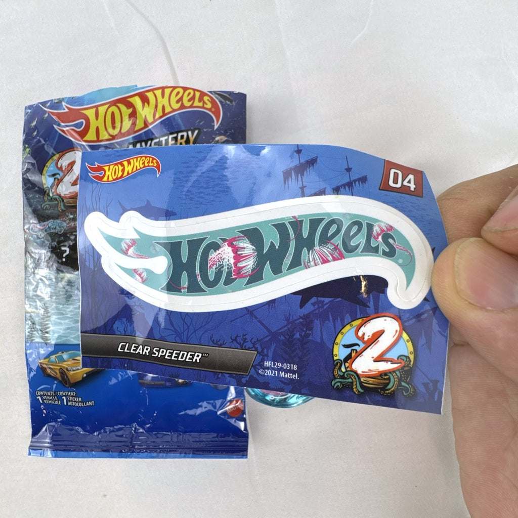 Hot Wheels Clear Speeder translucent blue diecast car Series 2 Mystery Model 04 with sticker sheet and packaging