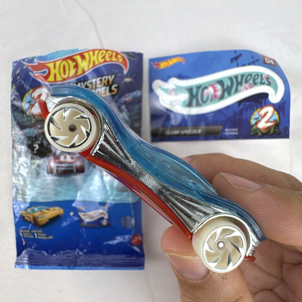Hot Wheels Clear Speeder translucent blue diecast car Series 2 Mystery Model 04 with sticker sheet and packaging