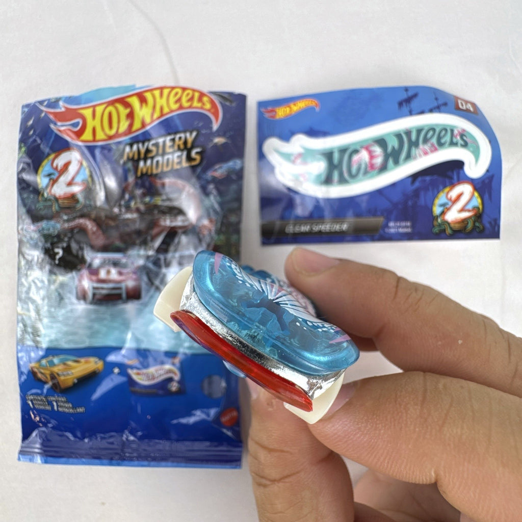 Hot Wheels Clear Speeder translucent blue diecast car Series 2 Mystery Model 04 with sticker sheet and packaging