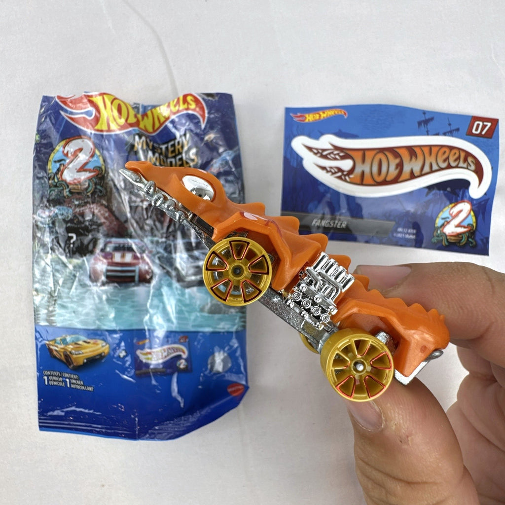 Hot Wheels Mystery Models Series 2 Fangster orange 1:64 scale diecast car with original bag and sticker