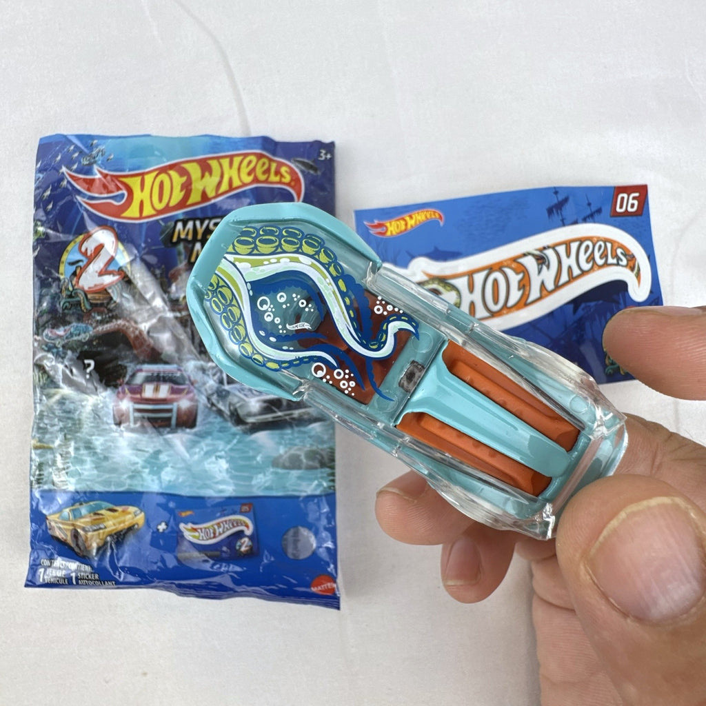 Hot Wheels El Viento Mystery Models Series 2 light blue diecast car with octopus graphics, foil pouch, and sticker card.
