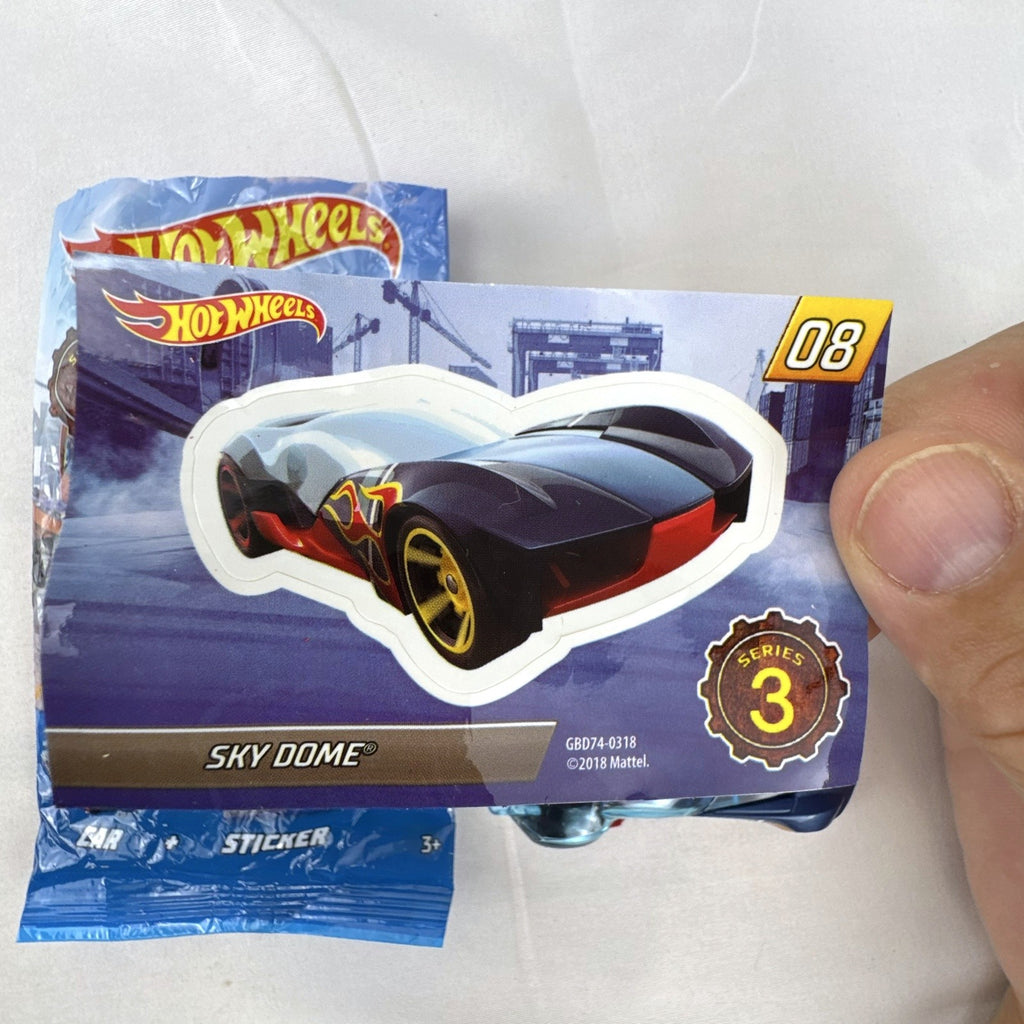 Hot Wheels Sky Dome 1:64 scale diecast car in dark blue with original Mystery Models Series 3 sticker card and bag.