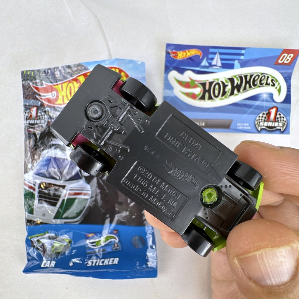 1:64 scale lime green Hot Wheels Driftsta #08 diecast car with Mystery Models sticker card and foil pack.
