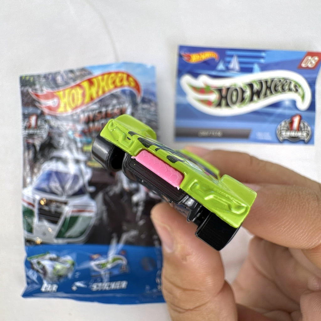 1:64 scale lime green Hot Wheels Driftsta #08 diecast car with Mystery Models sticker card and foil pack.