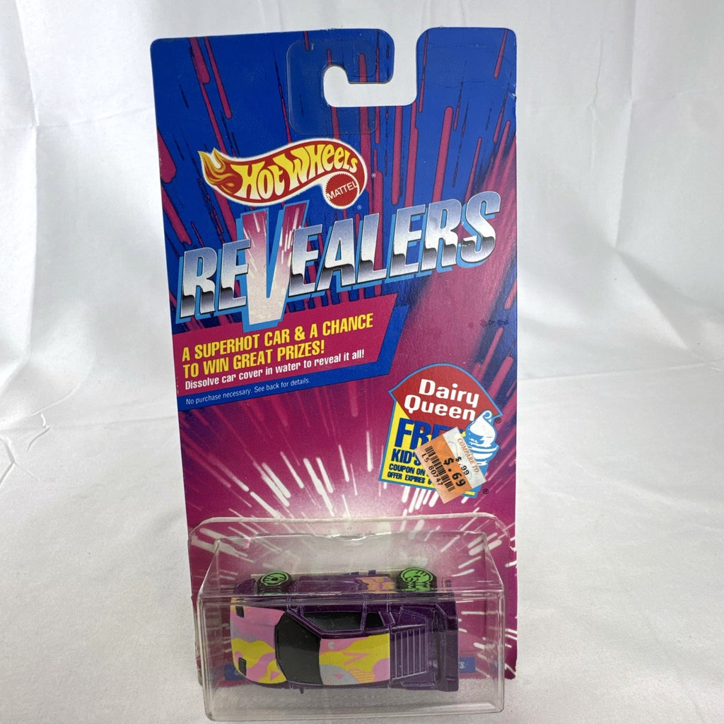 Sealed 1993 Hot Wheels Revealers 1:64 diecast car on Dairy Queen promo card with purple water-dissolvable cover