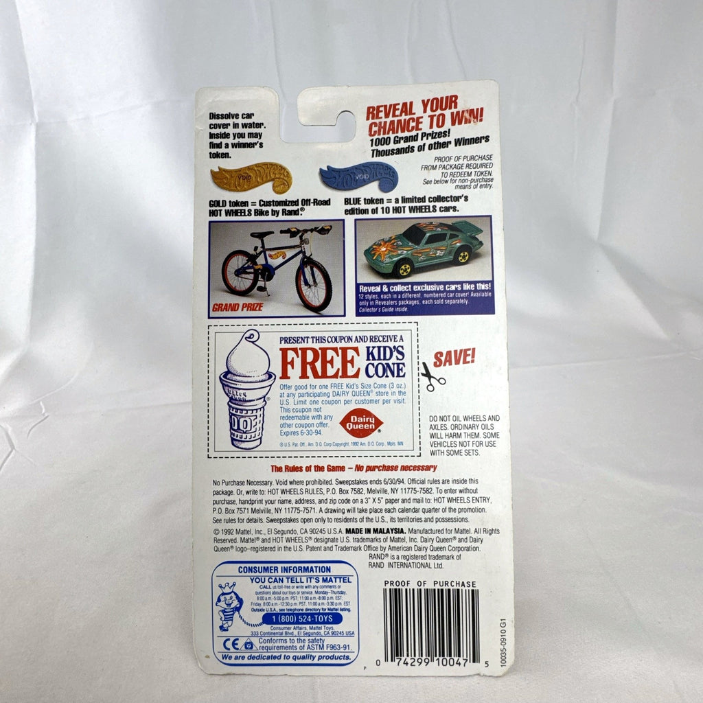 Sealed 1993 Hot Wheels Revealers 1:64 diecast car on Dairy Queen promo card with purple water-dissolvable cover