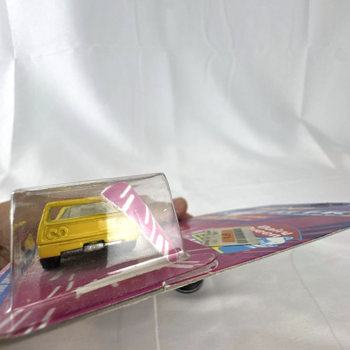 1993 Hot Wheels Ferrari F40 Dairy Queen Revealers diecast car in yellow with hot pink wheels on card