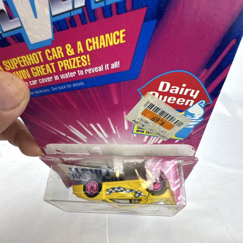 1993 Hot Wheels Ferrari F40 Dairy Queen Revealers diecast car in yellow with hot pink wheels on card