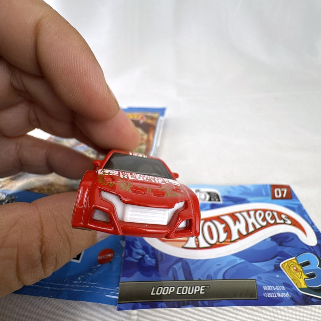 Hot Wheels Loop Coupe 1:64 scale red off-road rescue diecast car with mystery bag and sticker card.