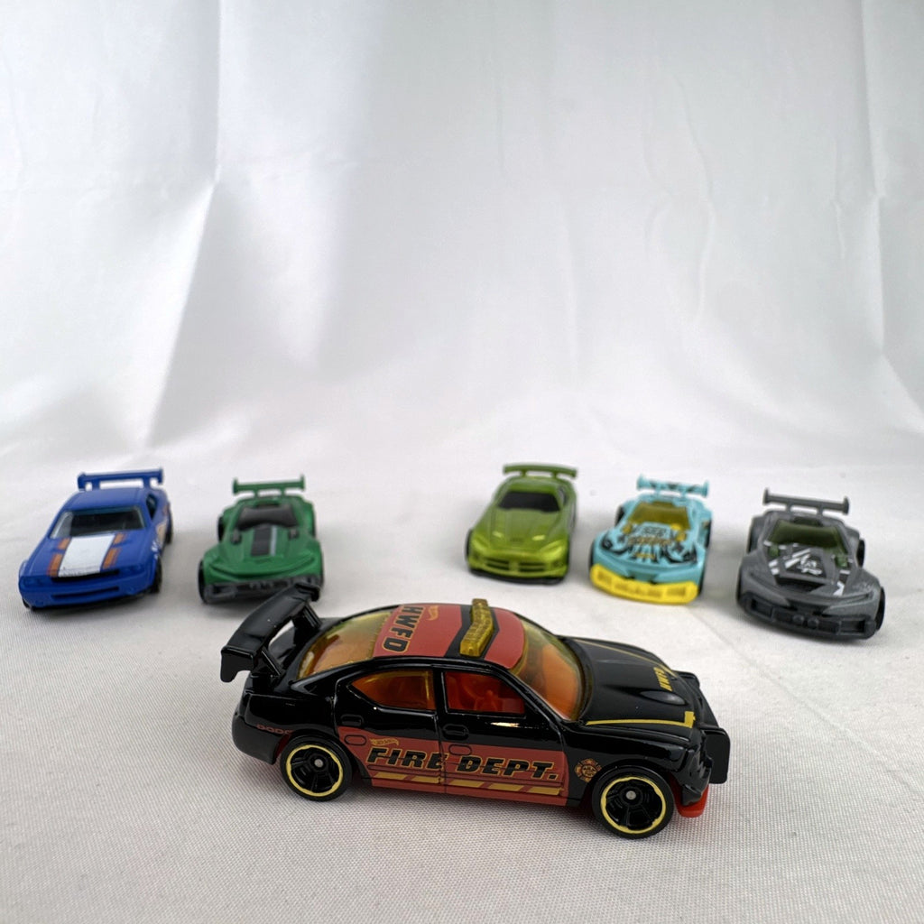 Six pre-owned 1:64 scale Hot Wheels diecast cars including Dodge Viper, Charger, Challenger, and Track Ripper models.