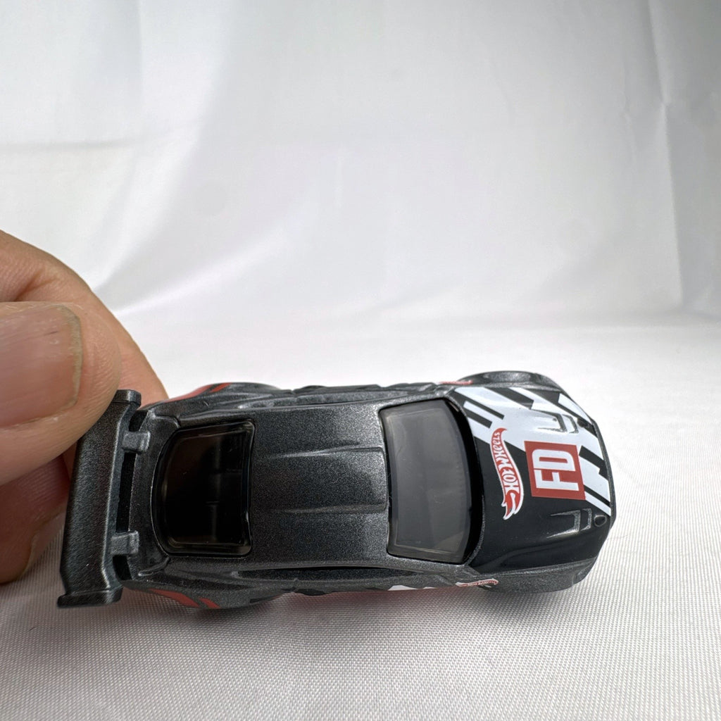 Hot Wheels 1:64 Custom '18 Ford Mustang GT Formula Drift diecast car in dark gray with red chassis base
