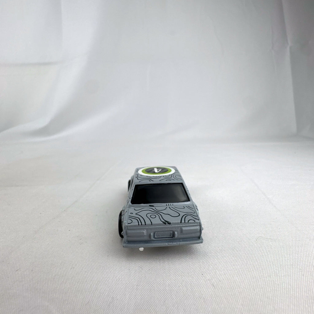 Hot Wheels 1:64 scale 1971 Datsun Bluebird 510 diecast car in grey with Kaido House topographic graphics