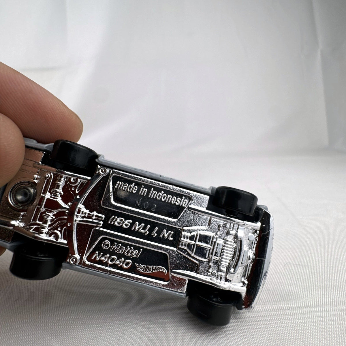 Hot Wheels 1:64 scale 1971 Datsun Bluebird 510 diecast car in grey with Kaido House topographic graphics