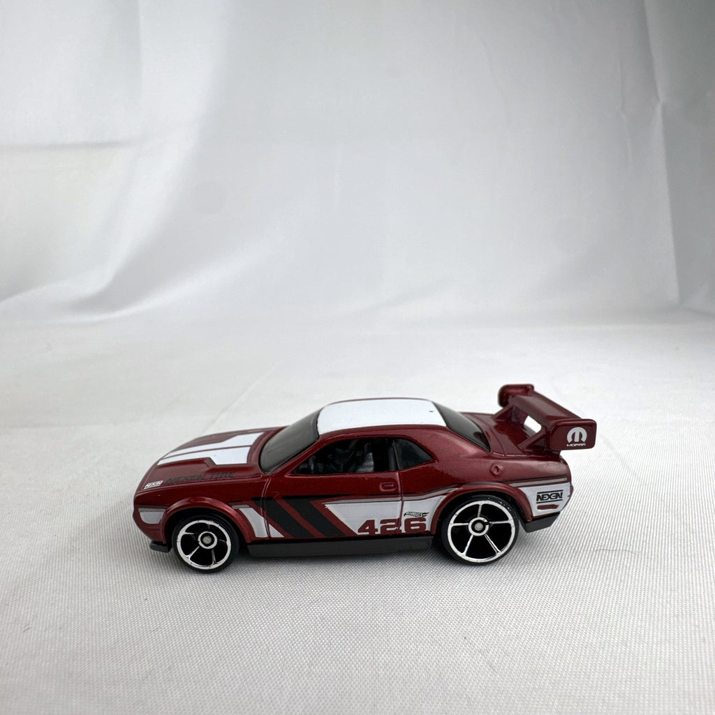 Hot Wheels 1:64 diecast Dodge Challenger Drift Car in metallic red with Mopar and Nexen Tire graphics
