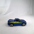 Matchbox 1995 The Buster 1:64 scale custom diecast pickup truck in metallic blue with yellow side graphics