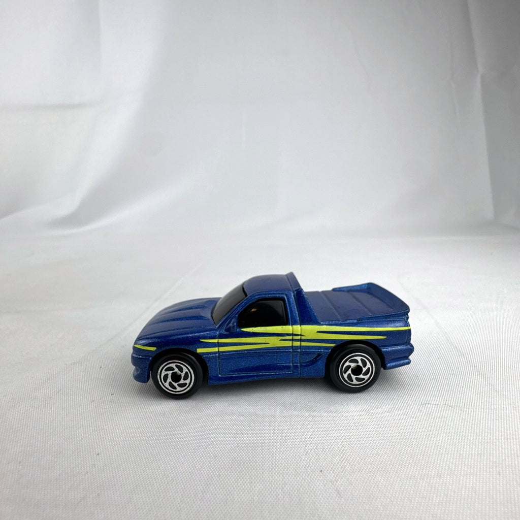 Matchbox 1995 The Buster 1:64 scale custom diecast pickup truck in metallic blue with yellow side graphics