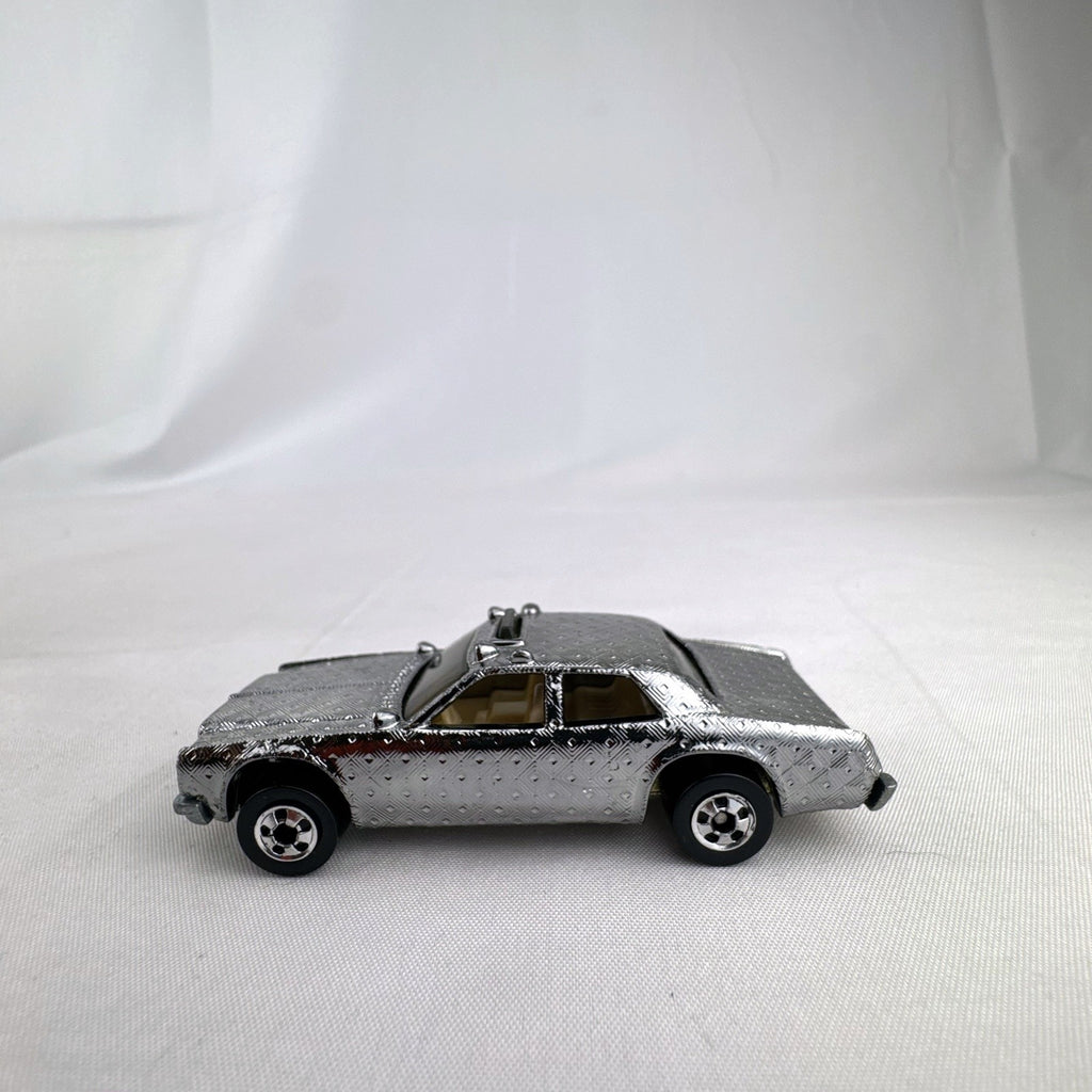 Hot Wheels 1:64 scale vintage Sheriff Patrol diecast car featuring an embossed silver chrome diamond finish