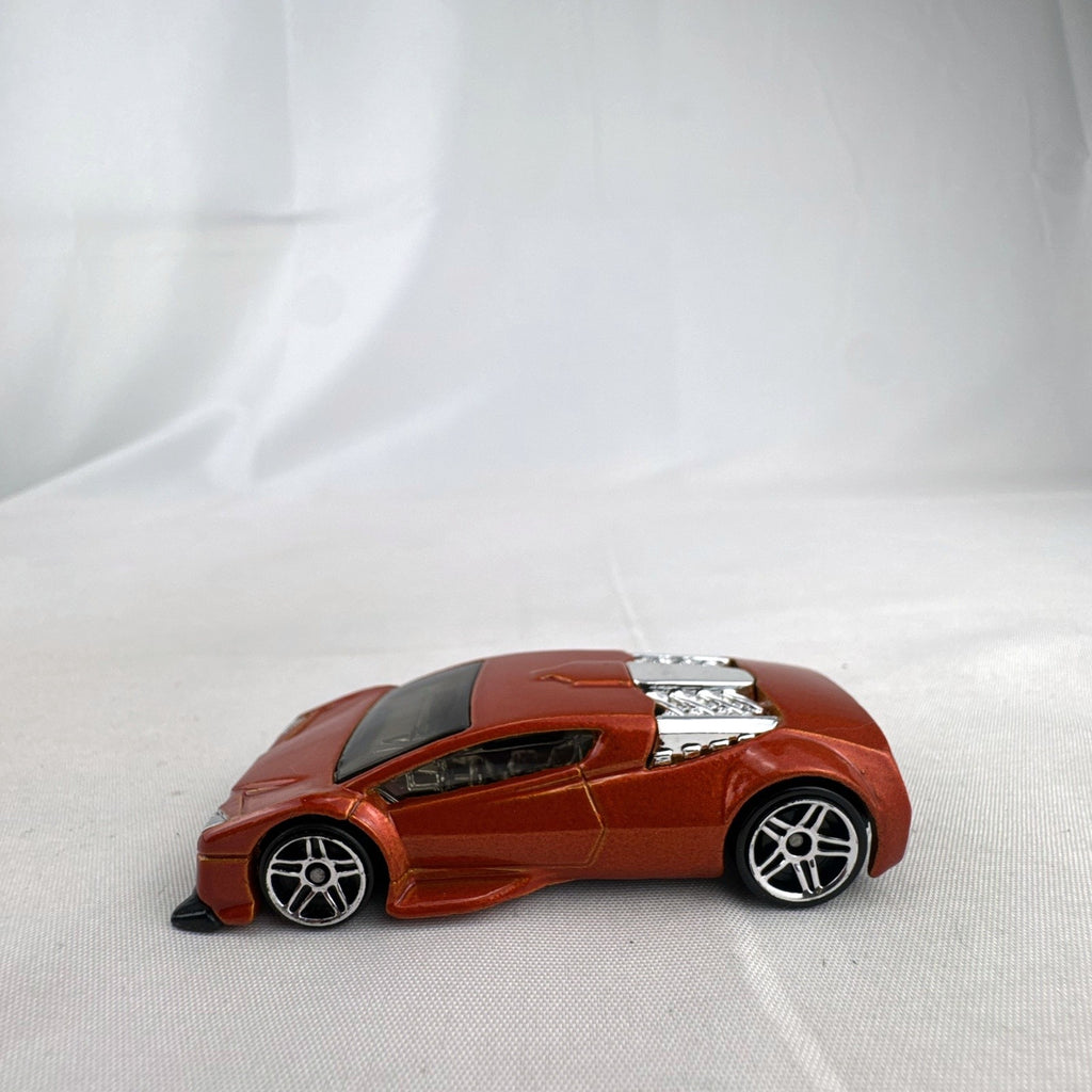 Hot Wheels Zotic 1:64 scale diecast concept car in metallic orange with chrome PR5 wheels
