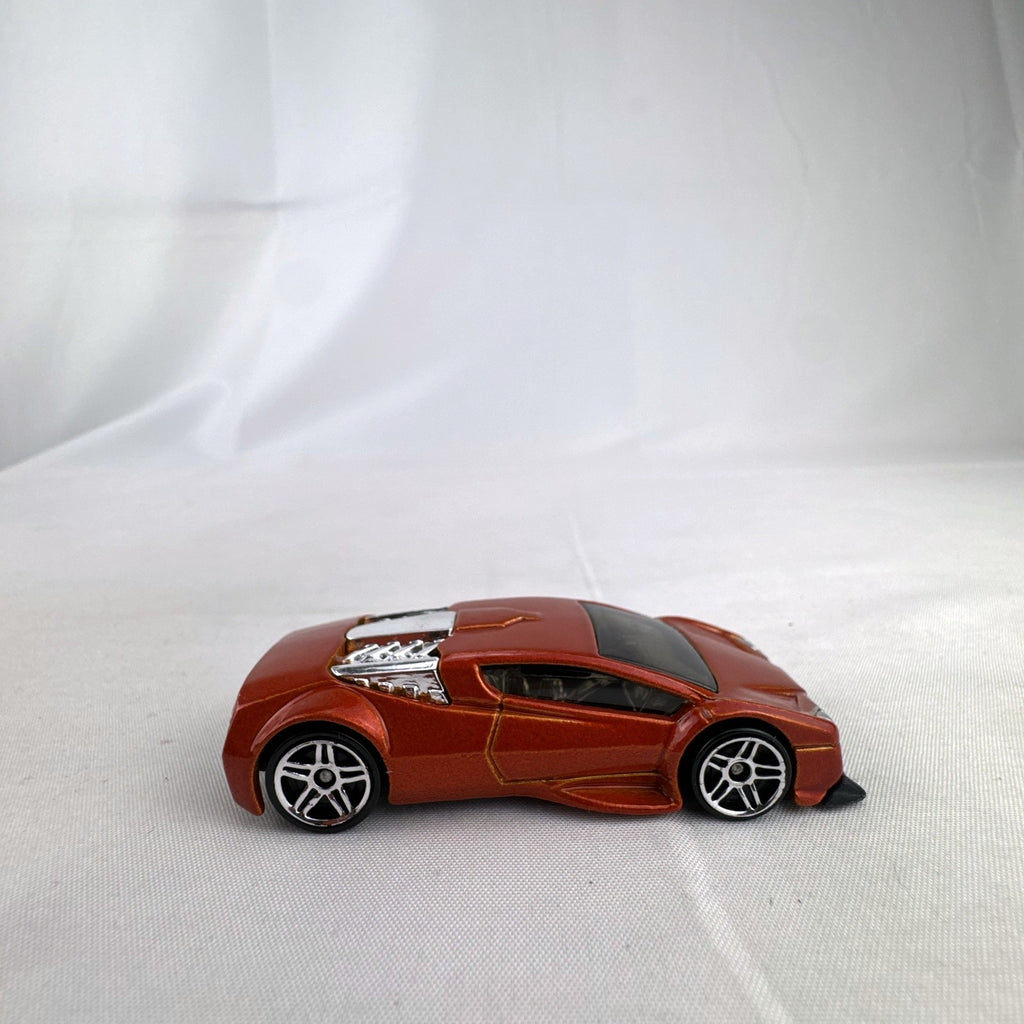 Hot Wheels Zotic 1:64 scale diecast concept car in metallic orange with chrome PR5 wheels