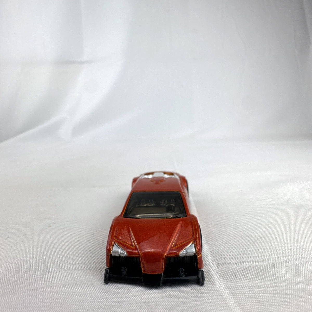 Hot Wheels Zotic 1:64 scale diecast concept car in metallic orange with chrome PR5 wheels