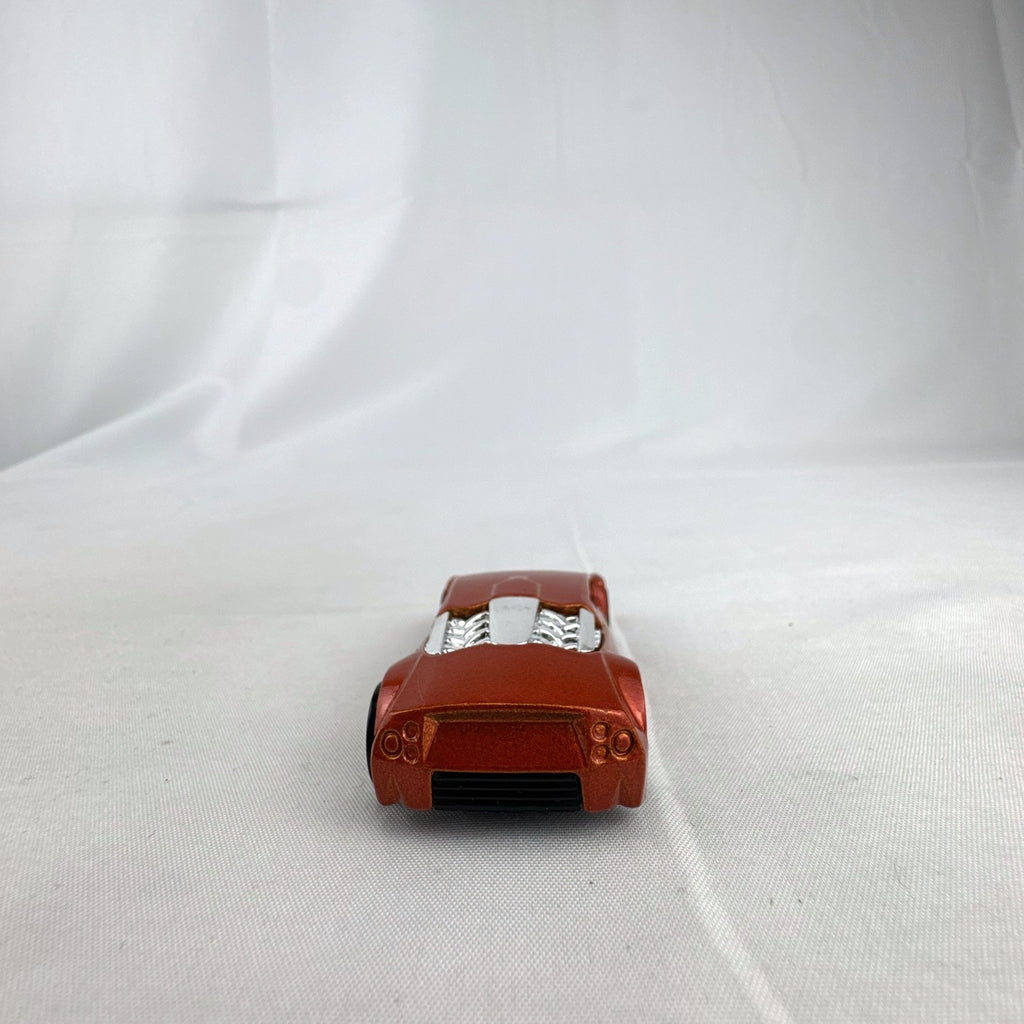 Hot Wheels Zotic 1:64 scale diecast concept car in metallic orange with chrome PR5 wheels