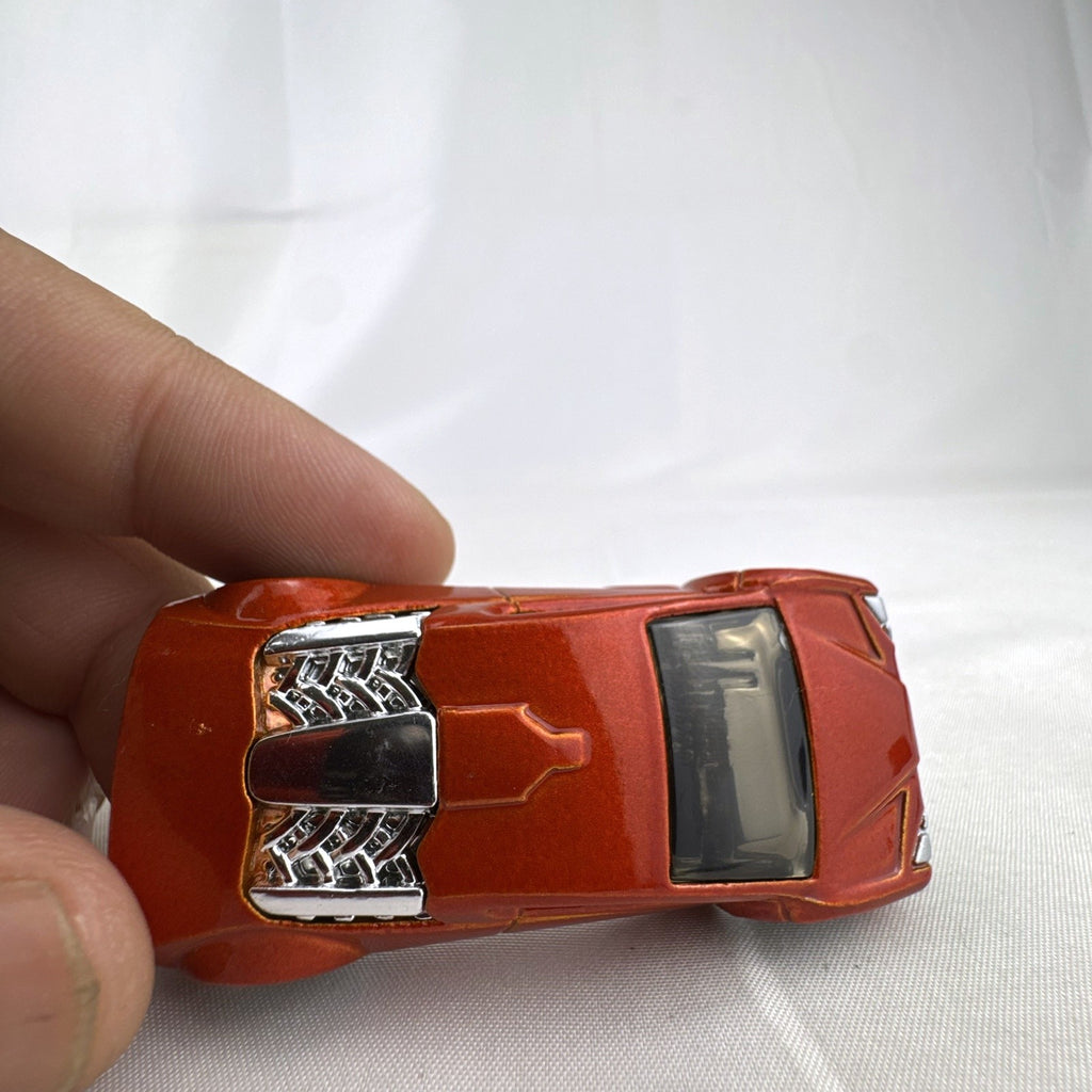 Hot Wheels Zotic 1:64 scale diecast concept car in metallic orange with chrome PR5 wheels