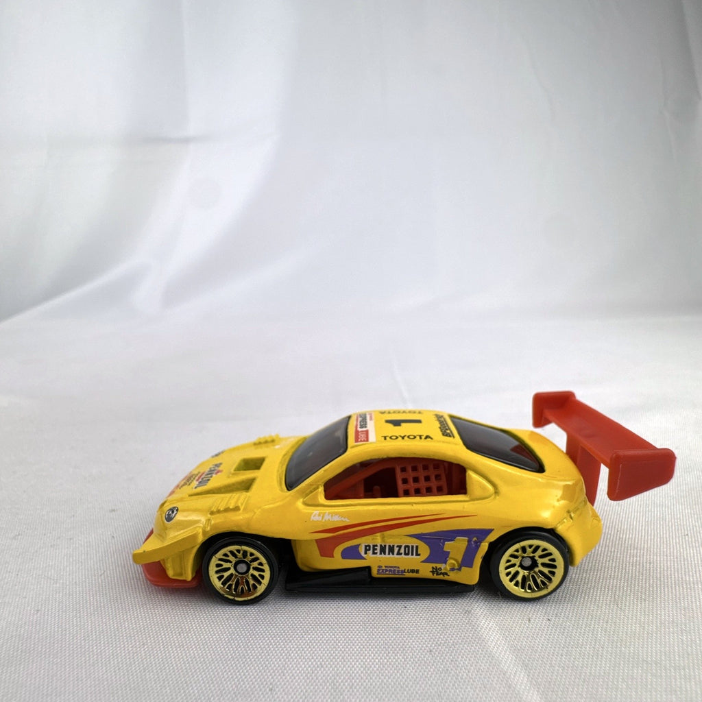 Hot Wheels 1:64 scale 1998 Toyota Pikes Peak Celica diecast race car in yellow Pennzoil livery