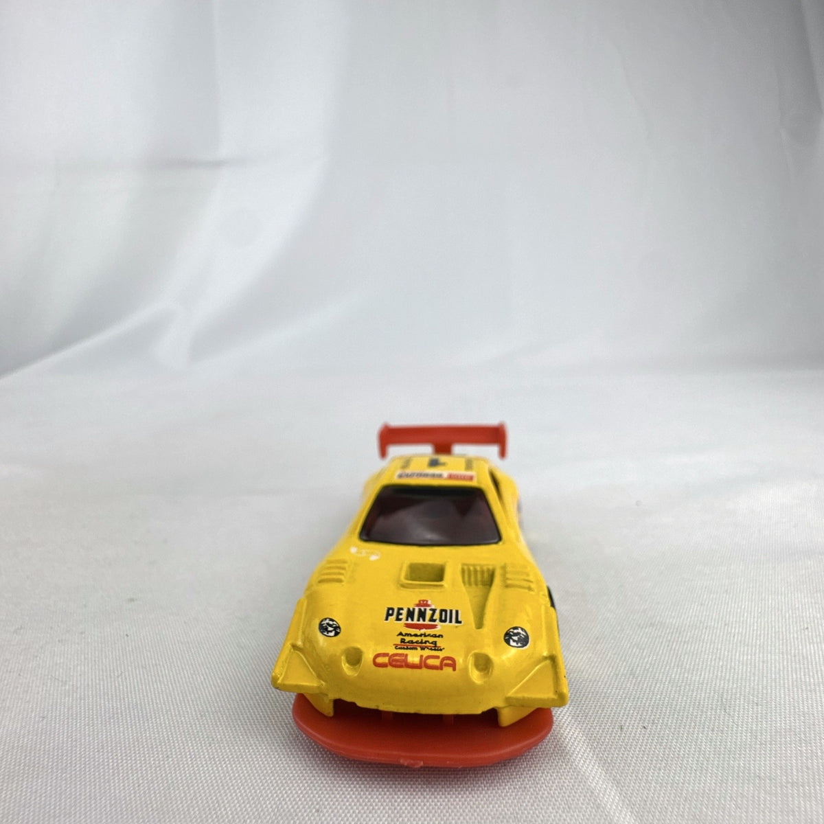Hot Wheels 1:64 scale 1998 Toyota Pikes Peak Celica diecast race car in yellow Pennzoil livery