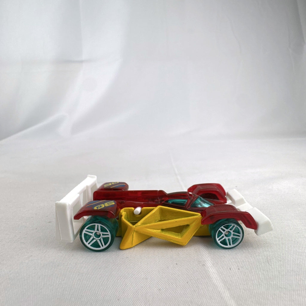 Hot Wheels Track Hammer X-Raycers diecast race car in translucent red with yellow chassis and teal wheels