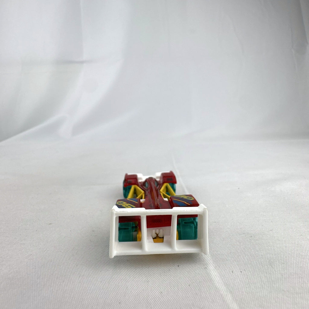 Hot Wheels Track Hammer X-Raycers diecast race car in translucent red with yellow chassis and teal wheels