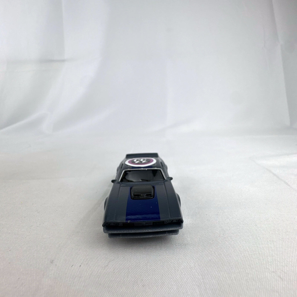 Hot Wheels 1:64 scale Ion Motors Thresher diecast car in gray with blue racing stripes from Fast and Furious Spy Racers