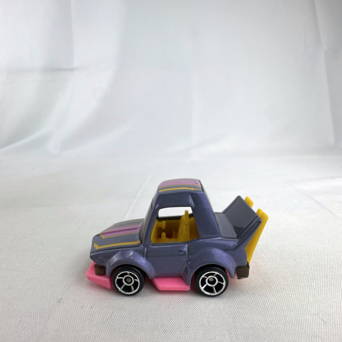 Hot Wheels HW Tooned Manga Tuner 1:64 scale diecast car in metallic purple with pink base