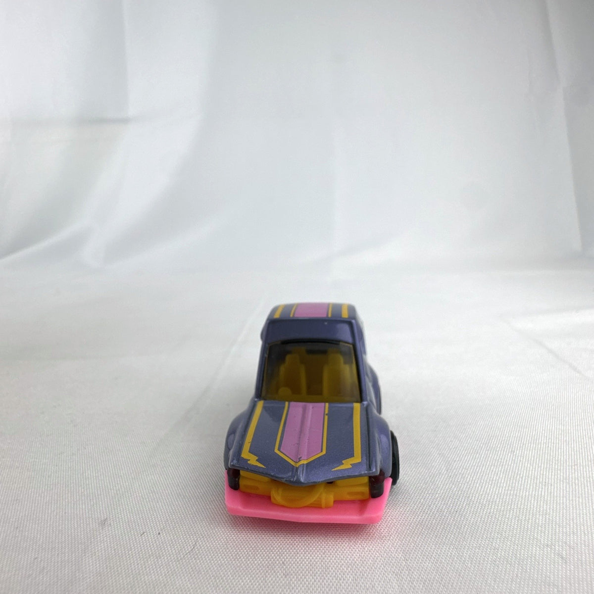 Hot Wheels HW Tooned Manga Tuner 1:64 scale diecast car in metallic purple with pink base