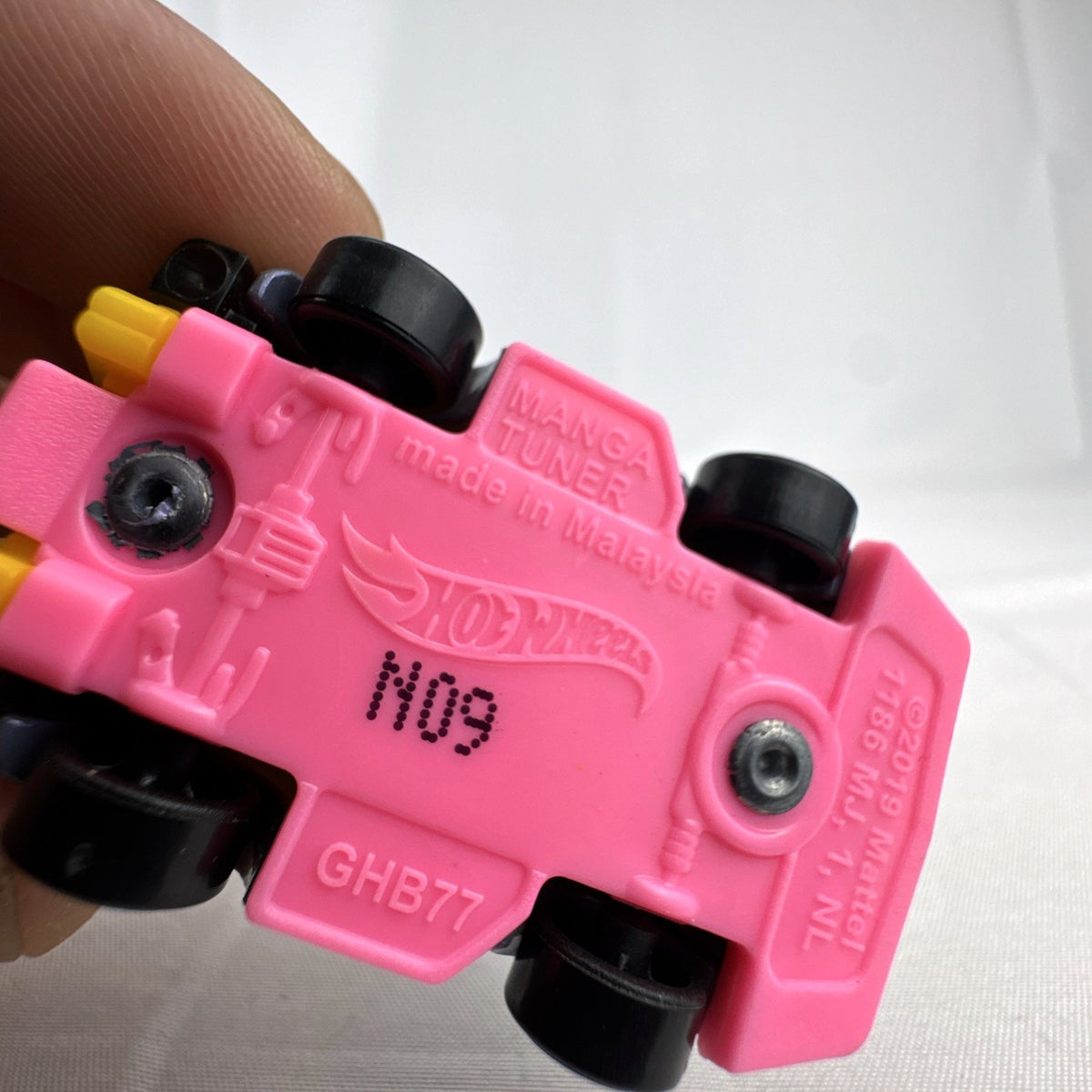 Hot Wheels HW Tooned Manga Tuner 1:64 scale diecast car in metallic purple with pink base