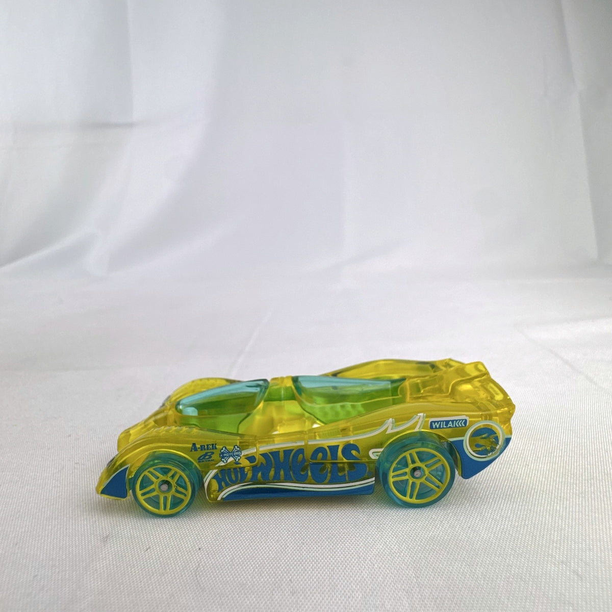 Hot Wheels HW X-Raycers Power Piston in translucent yellow with chrome chassis, 1:64 scale