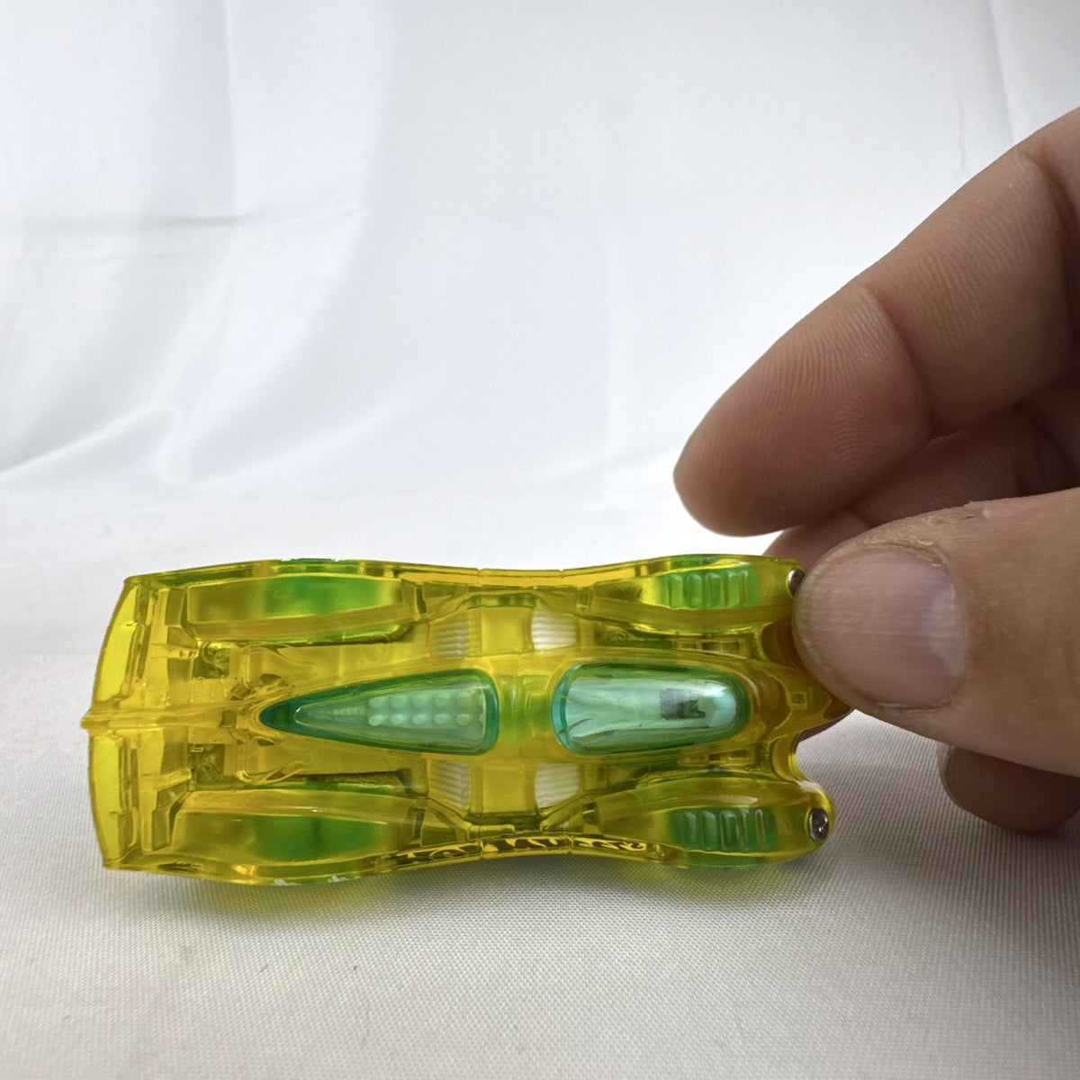 Hot Wheels HW X-Raycers Power Piston in translucent yellow with chrome chassis, 1:64 scale