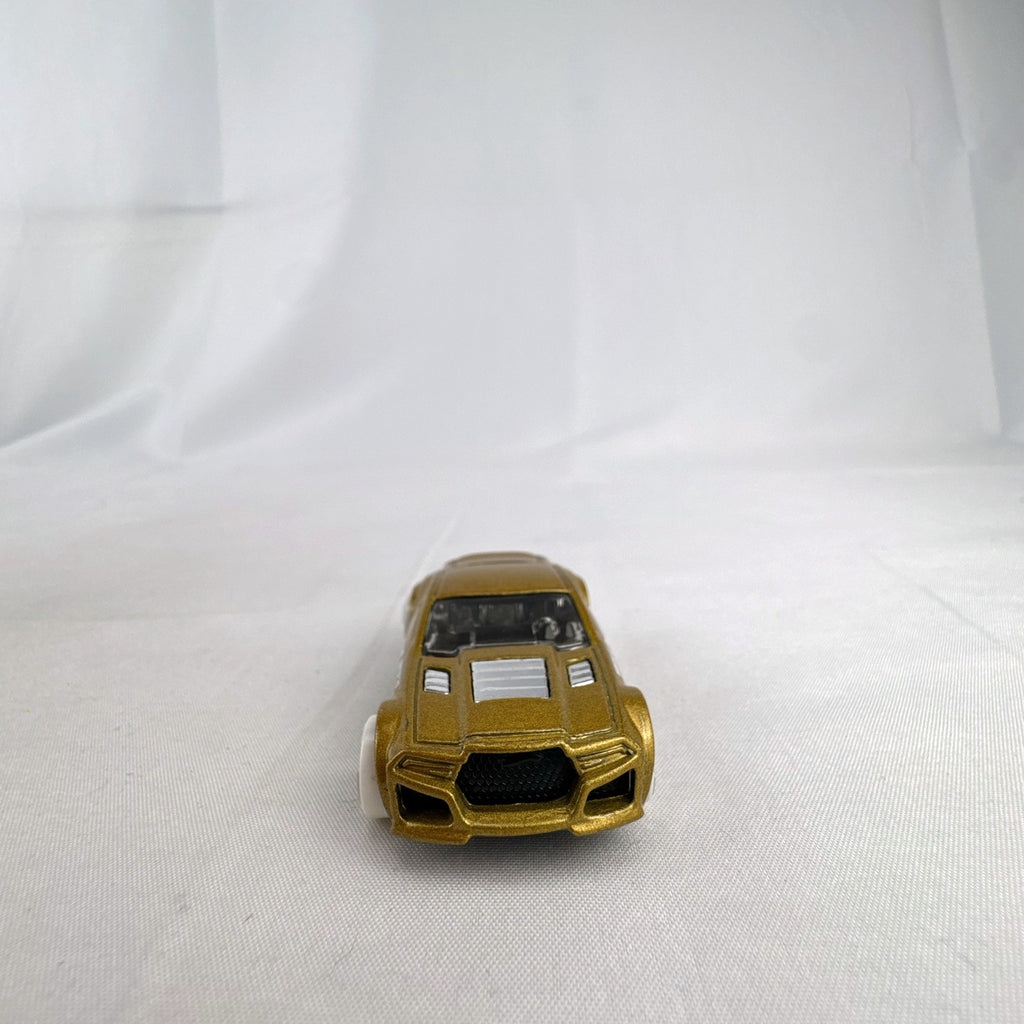 Hot Wheels Torque Twister diecast car in metallic gold with white wheels from the 2020 Winter series