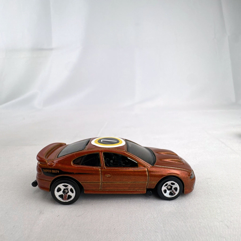 Hot Wheels 2006 Pontiac GTO Flying Customs diecast drag car in metallic copper orange