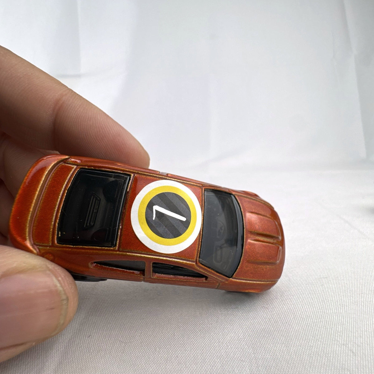 Hot Wheels 2006 Pontiac GTO Flying Customs diecast drag car in metallic copper orange
