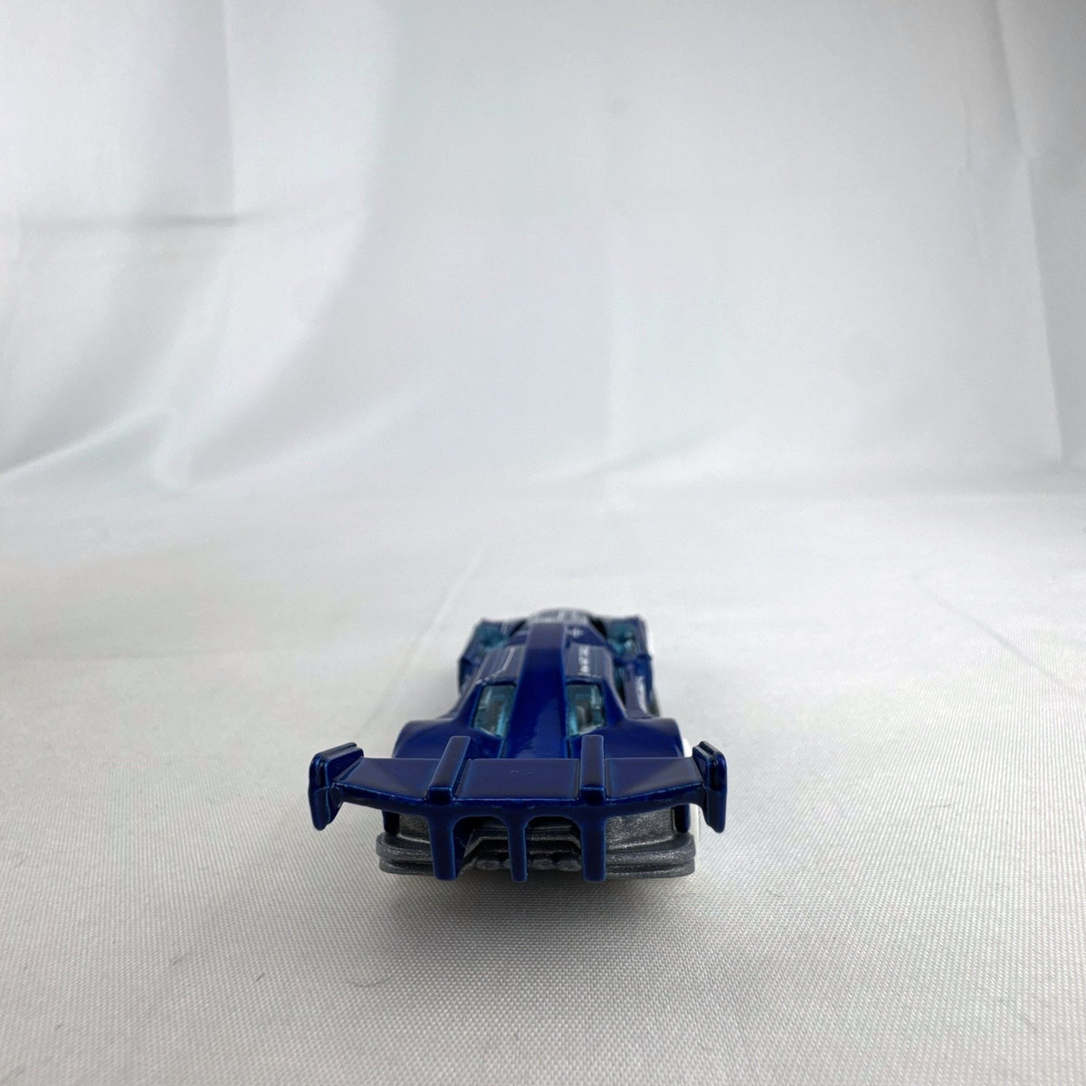 Hot Wheels 1:64 GT Hunter HW Art Cars diecast model in blue blueprint design with white wheels