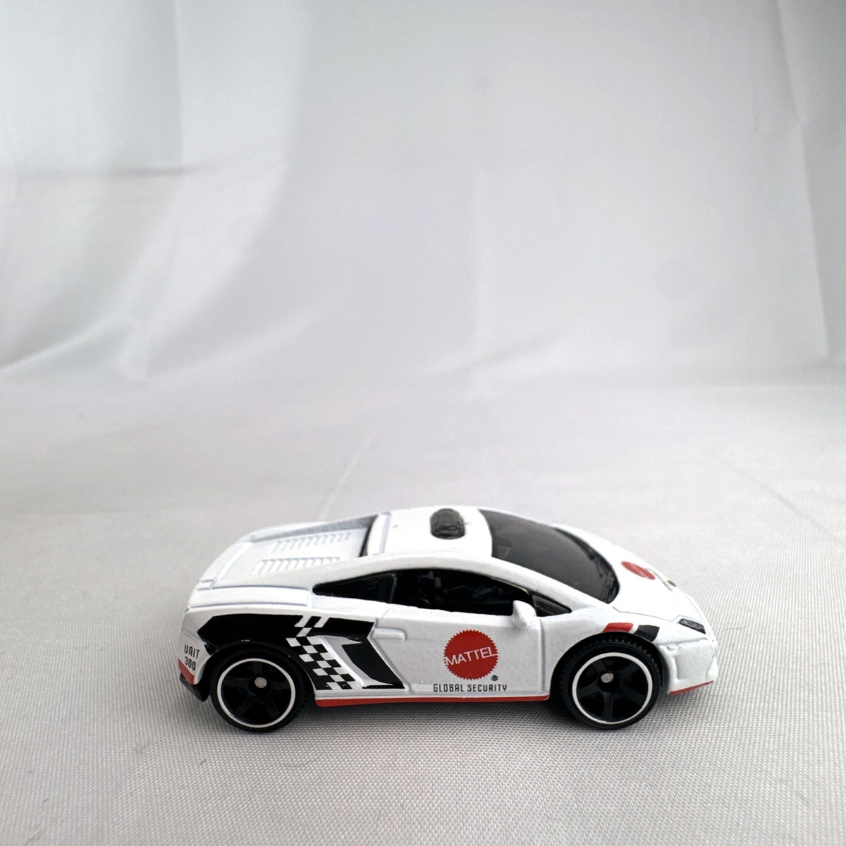 White Matchbox 1:64 scale Lamborghini Gallardo LP 560-4 Mattel Global Security diecast car with roof light bar