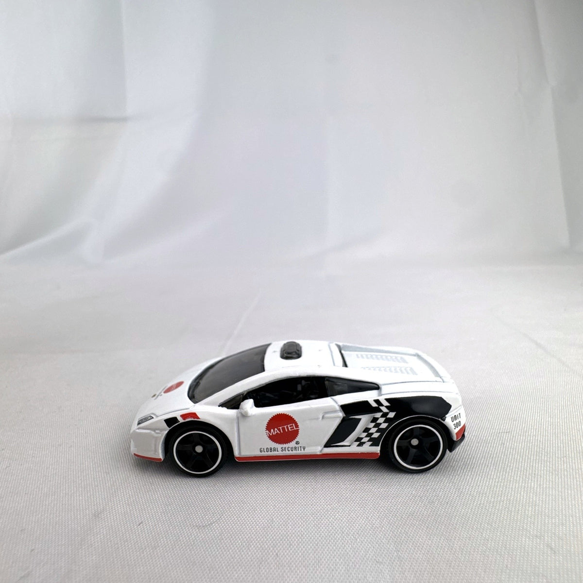 White Matchbox 1:64 scale Lamborghini Gallardo LP 560-4 Mattel Global Security diecast car with roof light bar