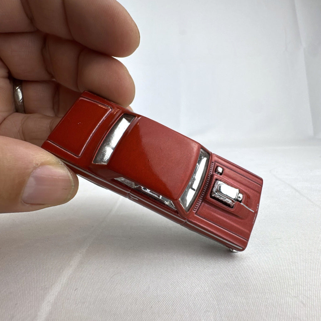 Hot Wheels 1:64 scale 1964 Chevrolet Chevelle SS diecast car in metallic dark red with exposed chrome blower