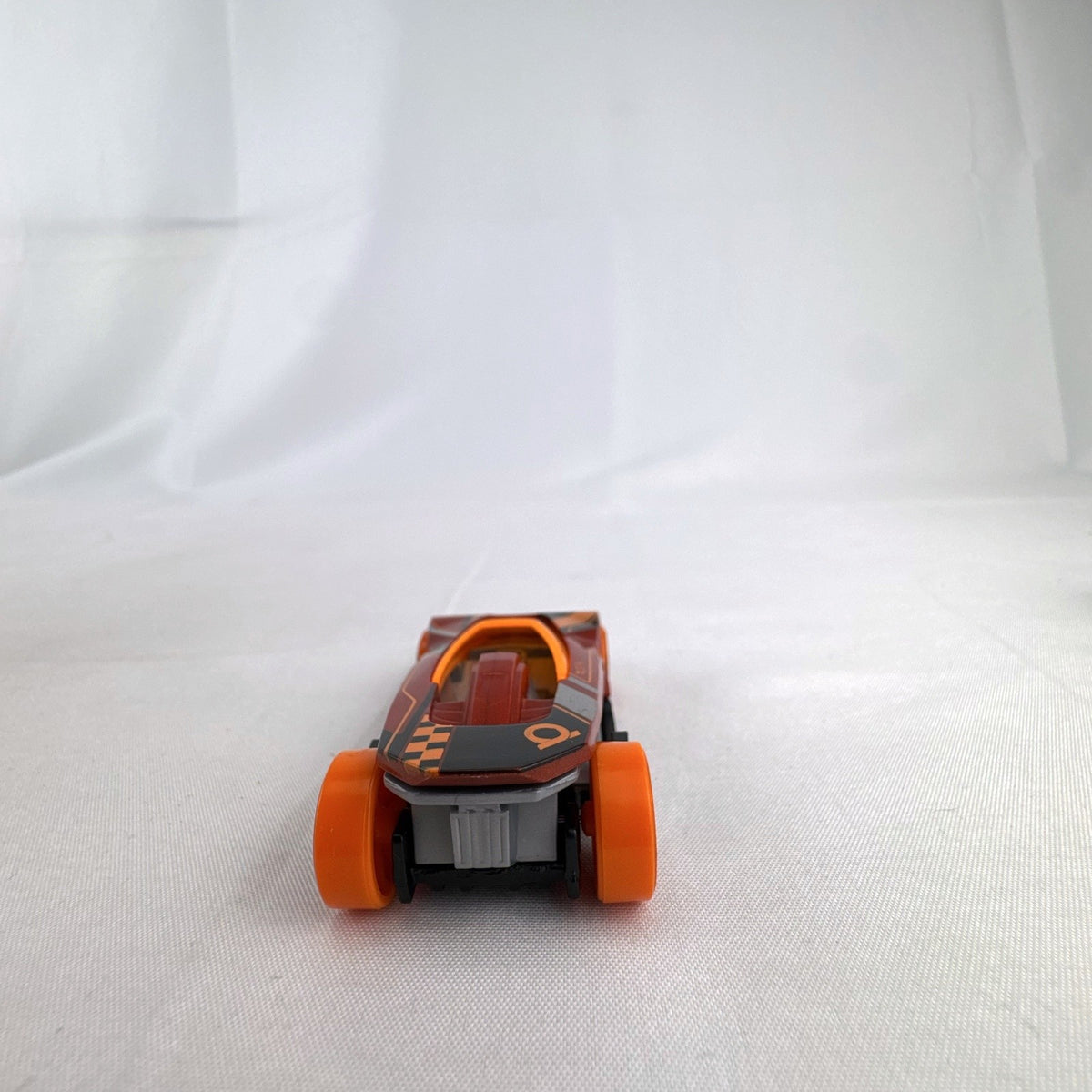 Hot Wheels HW Warp Speeder 1:64 diecast car in metallic red with orange canopy and wheels
