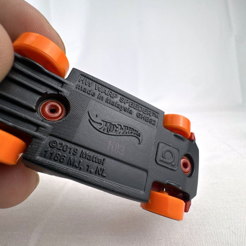 Hot Wheels HW Warp Speeder 1:64 diecast car in metallic red with orange canopy and wheels