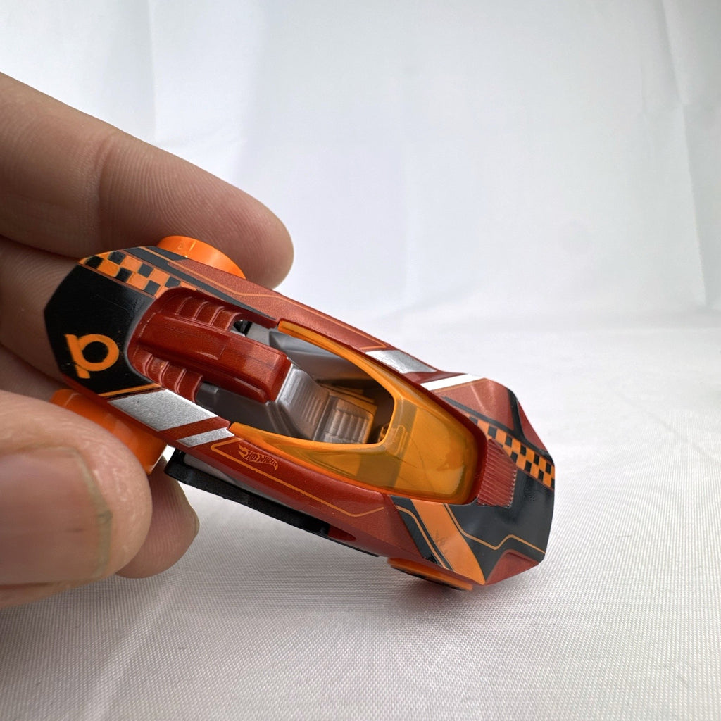 Hot Wheels HW Warp Speeder 1:64 diecast car in metallic red with orange canopy and wheels