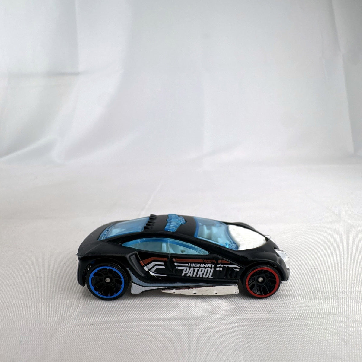 Hot Wheels Speed Trap 1:64 scale diecast police interceptor in black with HWPD patrol graphics