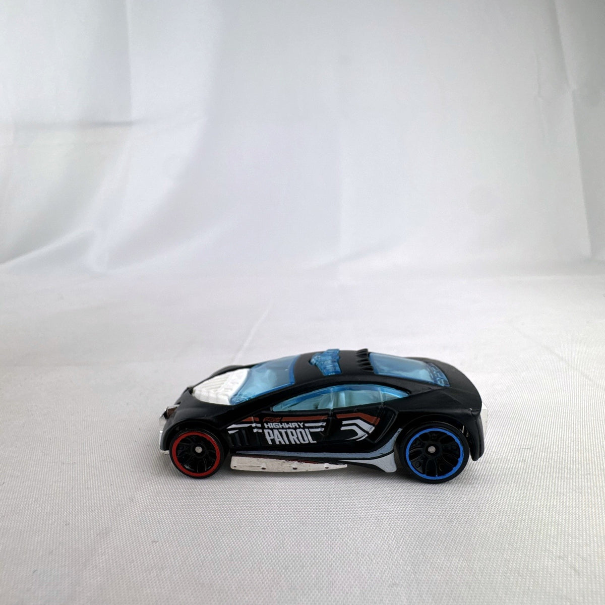 Hot Wheels Speed Trap 1:64 scale diecast police interceptor in black with HWPD patrol graphics