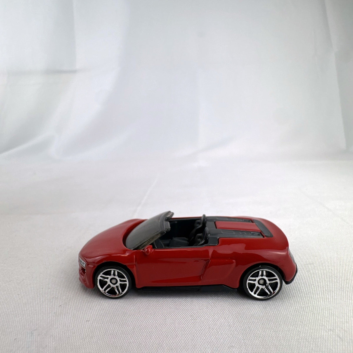 Hot Wheels 1:64 scale 2019 Audi R8 Spyder diecast convertible in red with chrome-spoke wheels